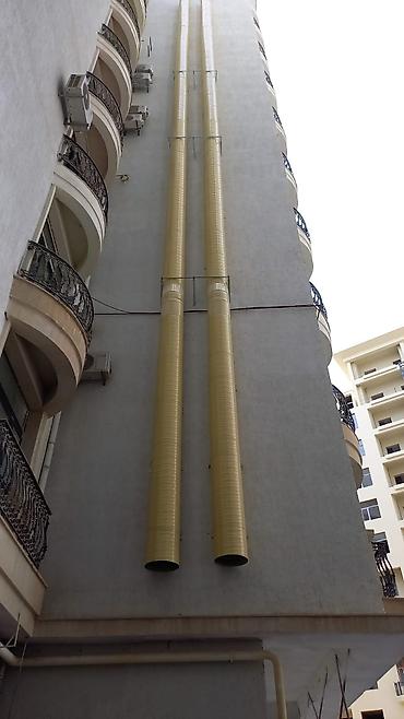 generator təmiri: Bina fasadında sənaye tipli havalandırma/çəkiş kanalları və — 2