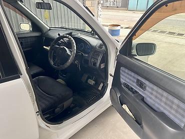 Частная аренда авто: Компактный городской хэтчбек Nissan Cube (JDM), белый цвет кузова — 9