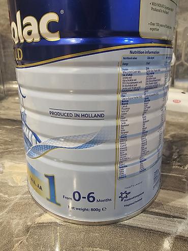 Qida məhsulları: Frisolac Gold 1 körpə yemi tozu. Üzərindən 4 qaşıq istifadə olunub — 2