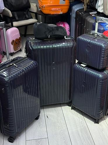 Чемоданы: Чемодан, Новый, Большой (более 70 л), Вращающиеся колеса на 360°, Кодовый замок, На колесах — 18