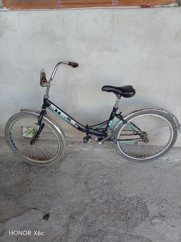 velosipedlər isma: STELS Pilot 24 şəhər/komfort tipli velosiped.Nasosda üstündə verilir — 7