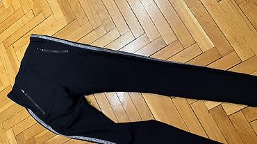 Pantalone, Farmerke, Šortsevi: Crne ženske helanke/pantalone uskog kroja sa dekorativnim srebrnim — 3