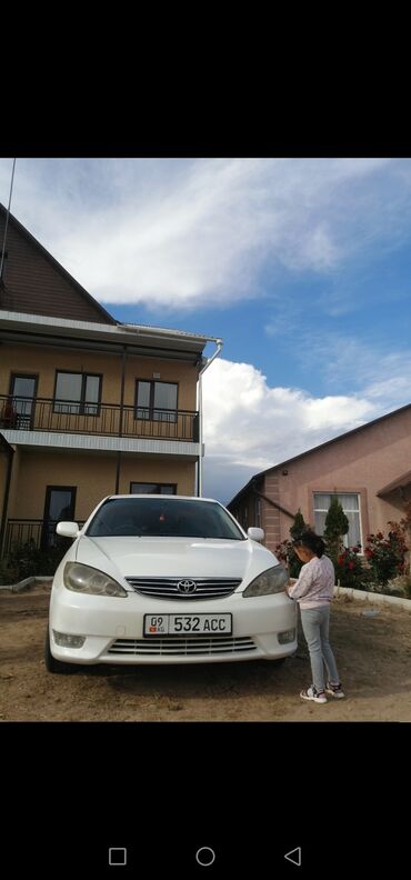 камри 30 американец: Автомобиль Toyota Camry в белом цвете. Это седан среднего размера