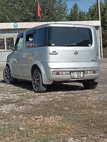 авто в такси: Nissan Cube: 2003 г., 1.3 л, Автомат, Бензин, Минивэн — 1