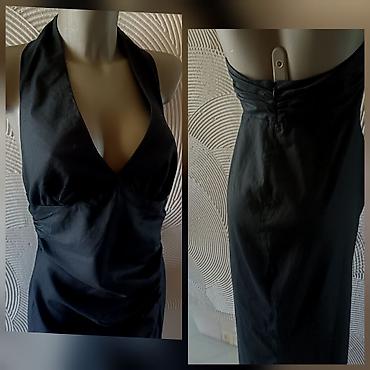 nike react patike: Elegantna crna haljina sa halter izrezom - Duga, uska silueta koja — 3
