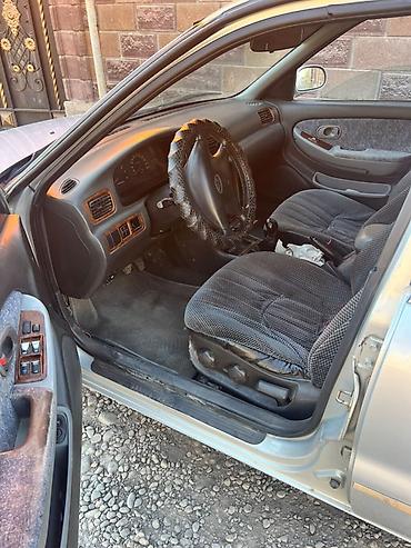 sprinter 4 4: Kia Clarus: 1999 г., Седан — 4