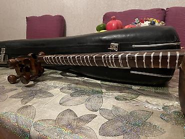 gitara satilir: Tar – milli simli musiqi aləti, sərt futlyarla Xüsusiyyətlər: - — 6