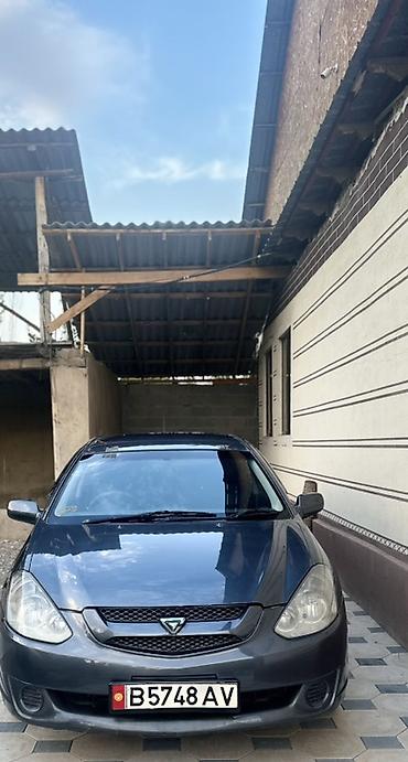 справа: Toyota Caldina: 2003 г., Универсал — 1