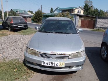 митсубиси диски: Mitsubishi Mirage седан, серебристый цвет, правый руль. Комpakt‑класс