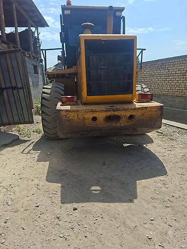 жосткий буксир: Погрузчик, 2012 г., Колесный, Фронтальный — 4