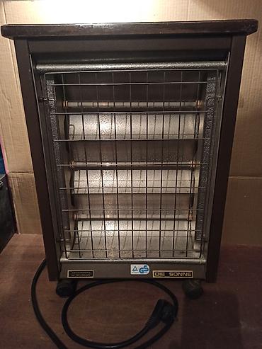 Kaloriferi: Mala kvarcna peć snage 1200W (3 x 400W) sa termostatom. Potpuno — 1