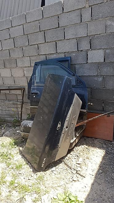 Автозапчасти: Автозапчасти для Daewoo Nexia - Крышка багажника (на надписи — 2