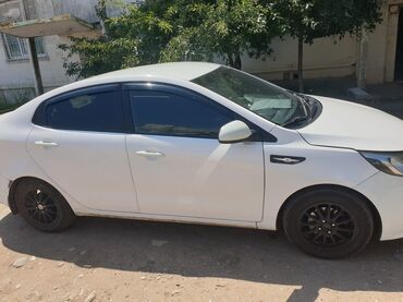 купить опель вектра с 2.2 бензин: Белый седан Kia Rio. Оснащен черными литыми дисками и тонированными