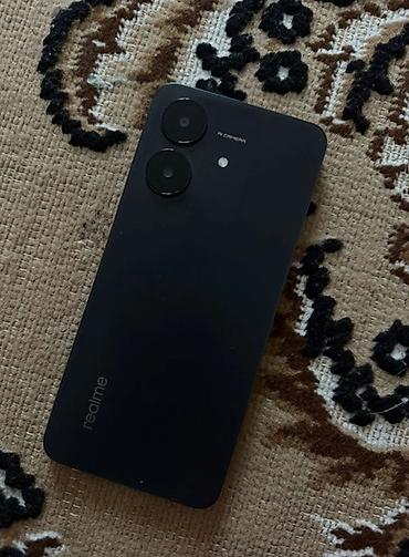 note 3: Смартфон realme, черный цвет. Основные особенности: - Корпус: матовый — 1