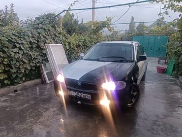 купить экскаватор погрузчик: Mazda 323: 2000 г., 1.5 л, Автомат, Бензин