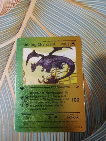 CD, DVD disklər və kassetlər: Shining Charizard basic kartı 100hp və 100 hasarı var 1 editiondur