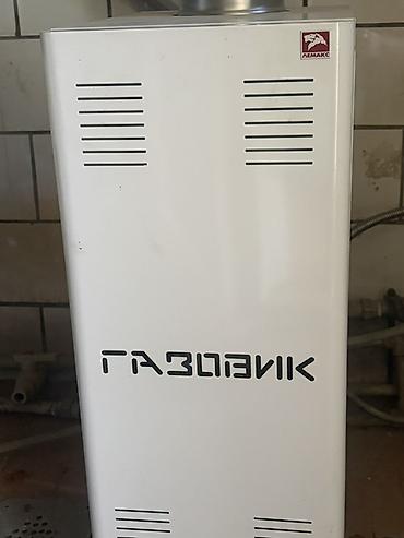 Газовый котёл Лемакс «Газовик» с дымоходом из нержавеющей стали.В