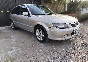 Mazda: Mazda Familia: 2004 г., 2 л, Кол менен иштөөчү, Газ, Хетчбек — 1