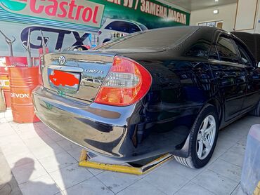 тойота урбан: Черный седан Toyota Camry XV30 с тонированными задними стеклами и