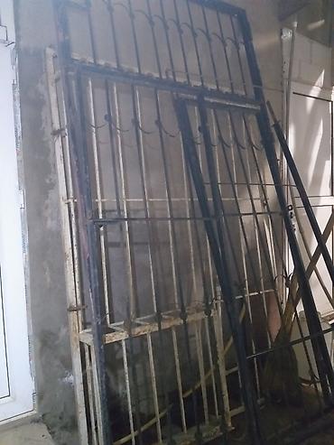 giris qapi: Dəmir reşotkalı iki kapılı ikisi də açılıb örtülür köç ilə bağlı — 4