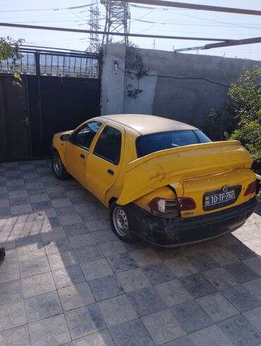sarı tofaş: Sarı rəngli bu sedan avtomobil gündəlik istifadə üçün uyğun bir