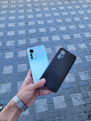 sony telfon: Xiaomi Mi 12 Lite, 256 ГБ, цвет - Голубой, 
 Кнопочный, Отпечаток пальца