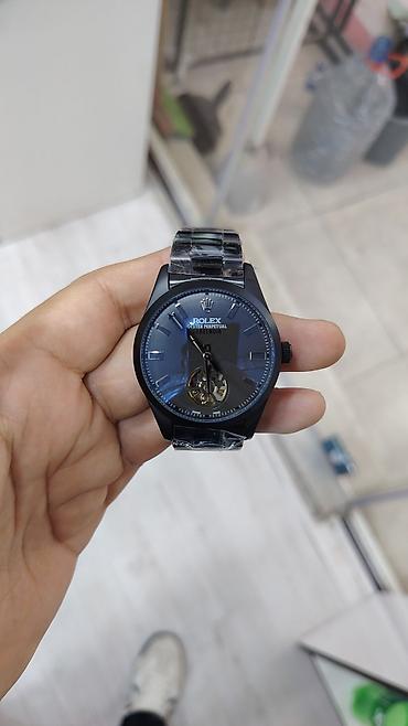 oyster saat: Saat: Kvars mexanizmi olan analoq qol saatı Model yazısı: “ROLEX — 9