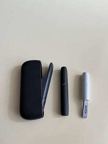 sarlar: IQOS 3 DUO heated tobacco cihazı satılır. Şəkillərdə qara rəngli — 4