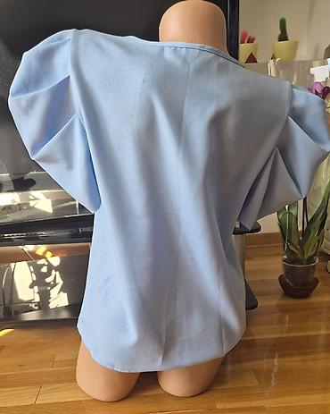 Bluze: Sedam bluzica sa neznatnim tragovima korišćenja. Zelena - M veličina — 6