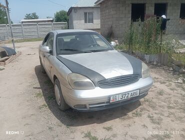 машина чолпон ата: Daewoo Lanos серебристого цвета. Это практичный и надежный автомобиль