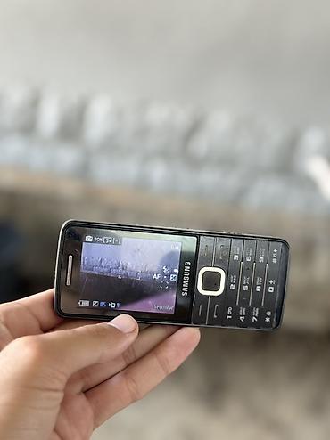 kontakt iphone 15 pro: Samsung S5610, rəng - Qara, Düyməli — 2