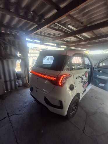 Другие автомобили: Электрический трехколесный автомобиль, представленный в белом цвете с — 2