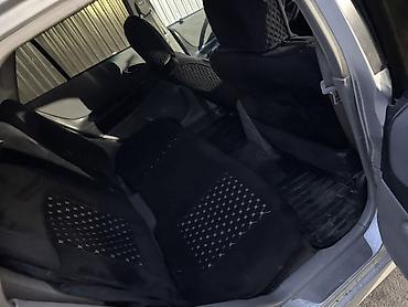 Mazda: Mazda 323: 2003 г., 1.3 л, Механика, Бензин, Универсал — 9