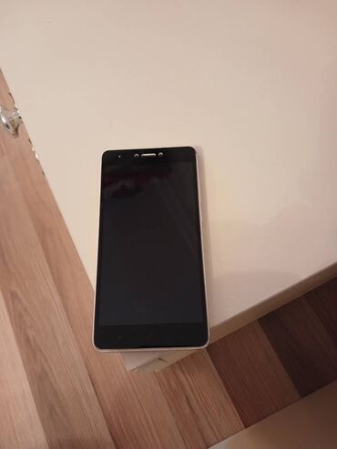 ЗАЗ: Xiaomi Mi 4i, 16 ГБ, цвет - Золотой, 
 Отпечаток пальца