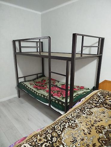 Двухъярусная металлическая кровать. - Прочная сварная рама из