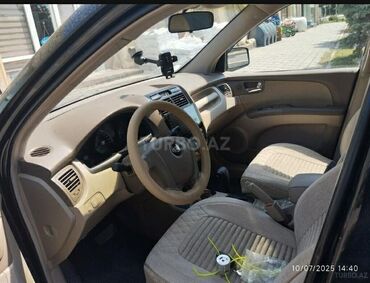 Kia: Kia Sportage – qara rəngli kompakt SUV Xarici: - Qara kuzov, 5 qapı - — 9