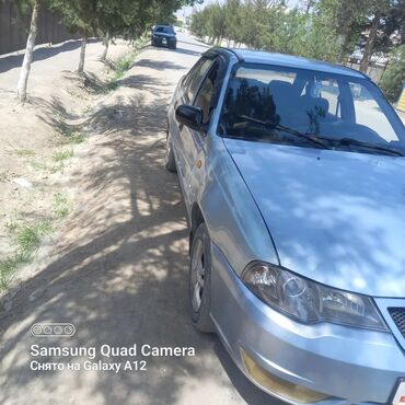 Другие Автомобили: Легковой автомобиль седан светло‑голубого цвета. Основные