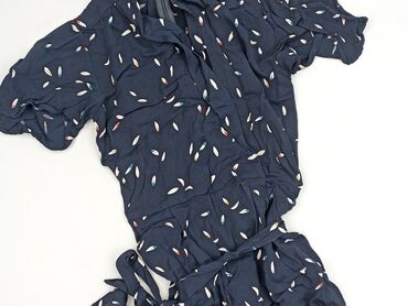 Ten kombinezon damski w ciemnym odcieniu to elegancka propozycja dla