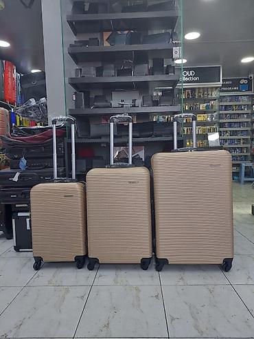 Çamadanlar: Sərnişin çamadan dəsti – 3 ölçü - Rəng: şampan/qızılı - Korpus: sərt — 1