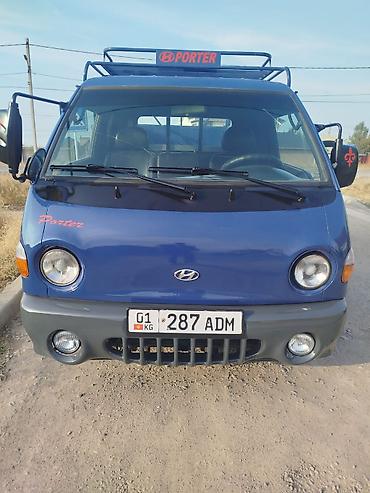 smart open: Hyundai Porter — компактный бортовой грузовик синего цвета. Основные — 1