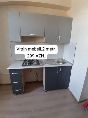 işlenmiş metbex mebeli: ◼️ Mətbəx mebeli.(Vitrin mebelidi). Ölçüsü 2 metr.Ustunde olan moyka