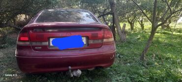 диска на хундай: Седан Mazda 626 темно-красного цвета с четырьмя дверями. Автомобиль