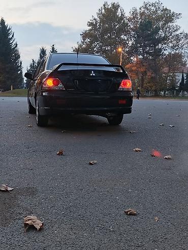 w202 qapı: Mitsubishi Lancer: 1.6 l | 2005 il 290000 km Sedan — 5
