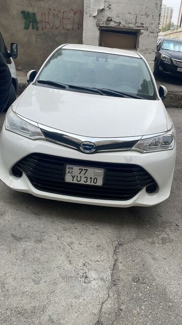 kvadrasikl satışı: Ağ rəngli sedan – Toyota markasının Yaris/Corolla Axio xəttinə bənzər