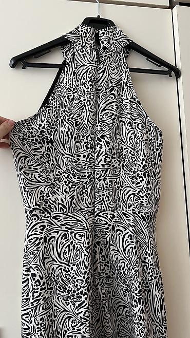 Ziyafət donları: - Məhsul: Oversize T‑shirt - Brend/Qrafika: “NEW ERA” mövzulu çap; ön — 13