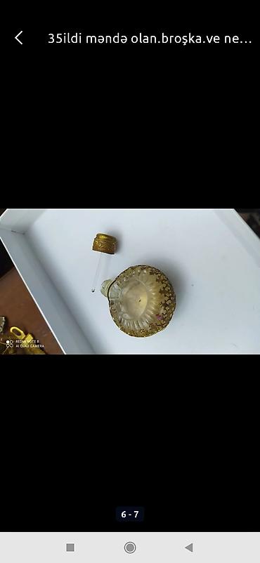 kəhrəba nədir: Ətir qabı 45 ilin. 150m.necedir elədir.ortasinda olan olan — 2