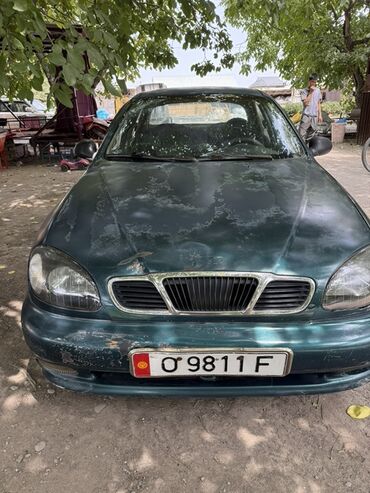 передний бампер ланос цена: Седан Daewoo Lanos зеленого цвета, оснащенный механической коробкой