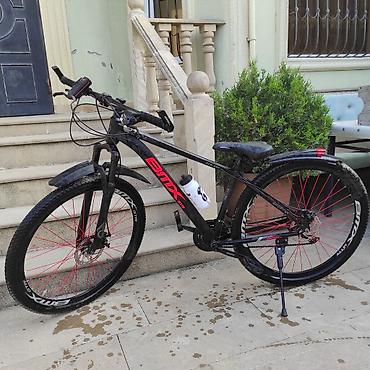 Dağ velosipedləri: BİMX pro markalı dağ tipli velosiped. Qara rəngli gövdəyə qırmızı — 1