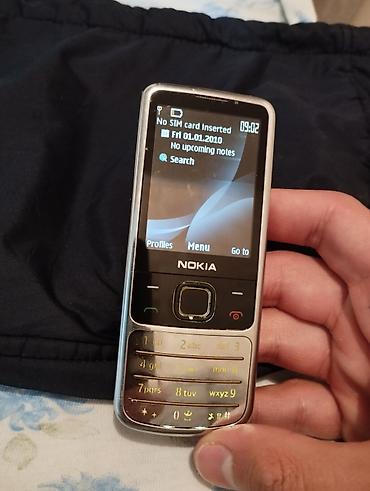 retro telefon: Nokia 6700 Slide, < 2 GB Memory Capacity, rəng - Gümüşü, Düyməli — 1