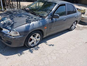 prius teker: Mitsubishi Lancer: 1.3 l | 1997 il Sedan — 1